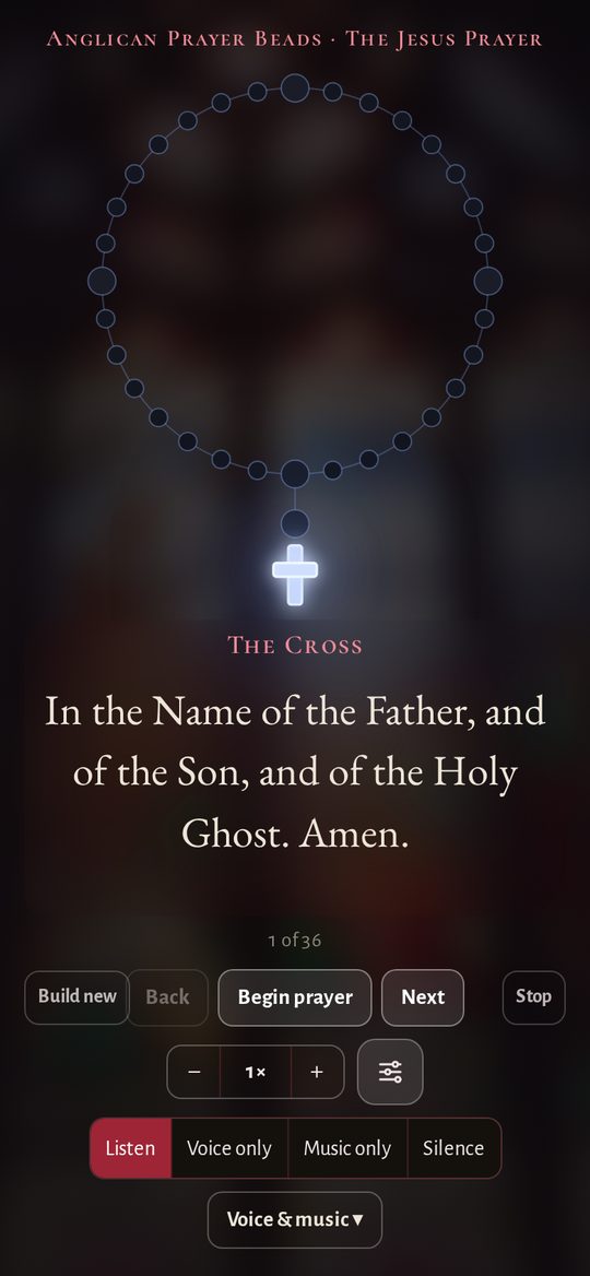 An Anglican rosary with the current bead glowing blue
